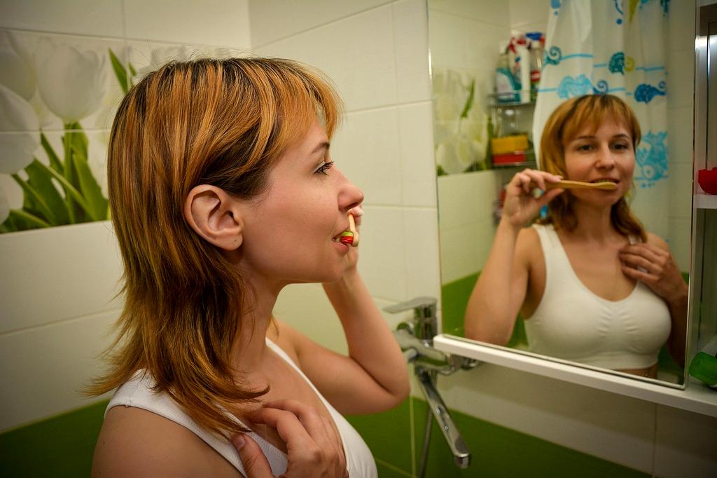 Person practicing mindful morning routine with journal and tea
